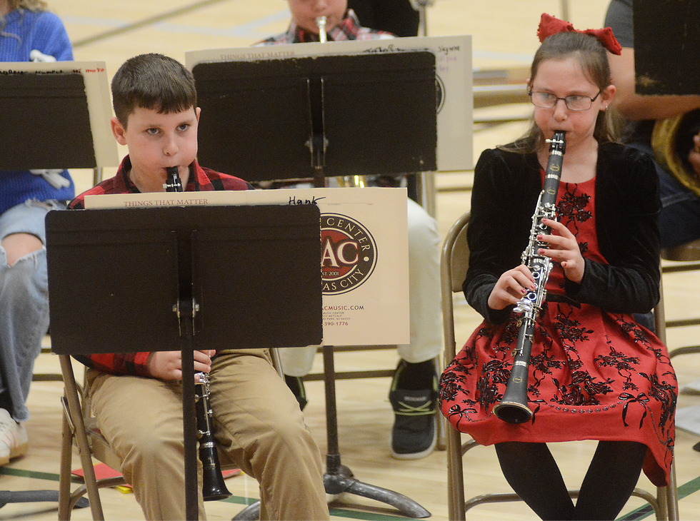 These fifth-grade clarinet players keep their eyes on the band director and music sheets as they played "Rudolph the Red Nosed Reindeer.