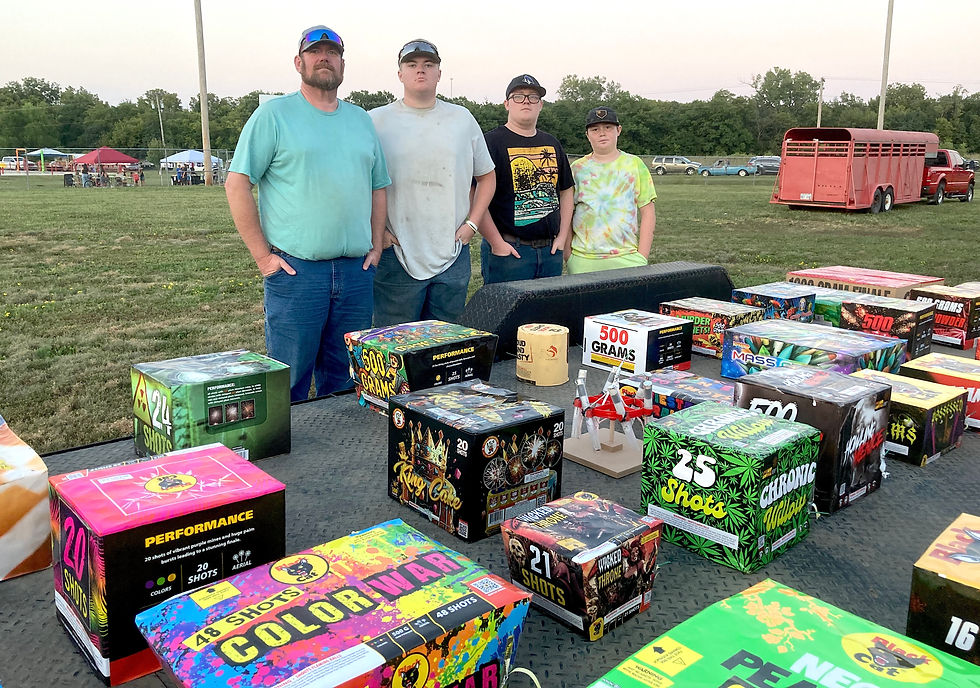 The Baldwin family pyrotechnicians for the fireworks display include, from left, Matt, Braden, Lincoln and Hudson. The Baldwins had three flatbed trailers full of fireworks, including this trailer of about 30 "cakes," while had as many as 50 or more separate charges in each package.