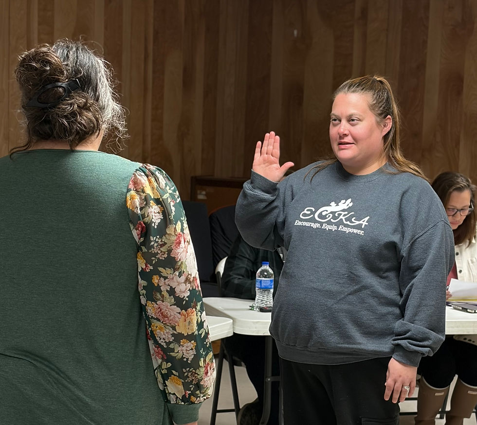 Returning Councilmember Kari Brandt takes the oath of office. (Roger Sims / Linn County Journal)