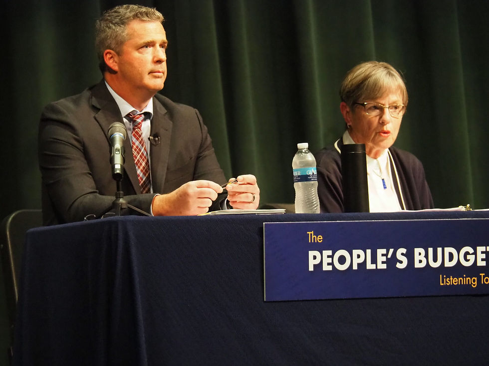 Democratic Gov. Laura Kelly, right, joins state budget director Adam Proffitt, who also serves as secretary of the Kansas Department of Administrator, in Hays for a stop on an eight-city tour to hear from the public about their priorities for state government spending. (Photo by Tim Carpenter/Kansas Reflector)
