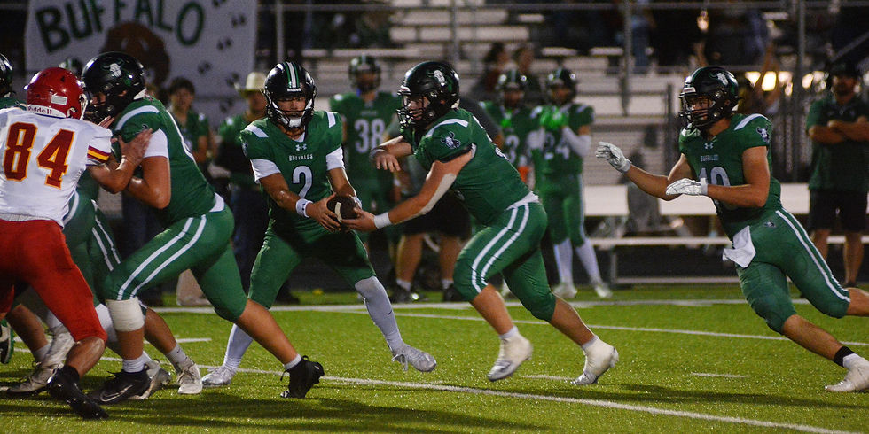 Prairie View quarterback Gabe Moore hands off to Carter Browning.