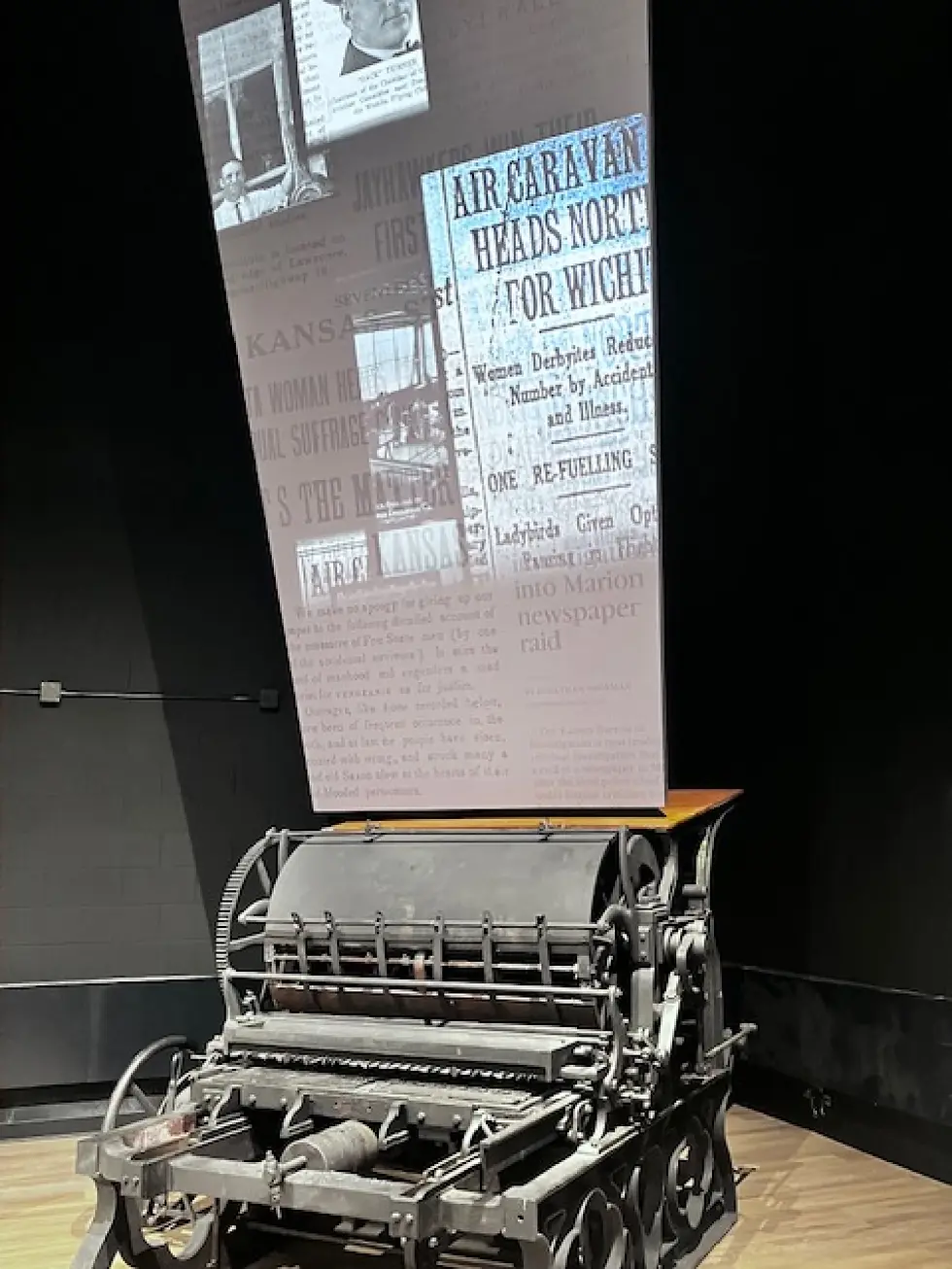 Projected images bring the original printing press from William Allen White’s Emporia Gazette to life in the renovated Kansas Museum of History. (Jim McLean / KPR News)