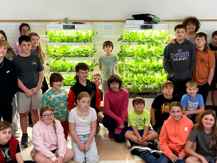 Growing their own: Jayhawk students use hydroponic towers to grow lettuce for the lunchroom