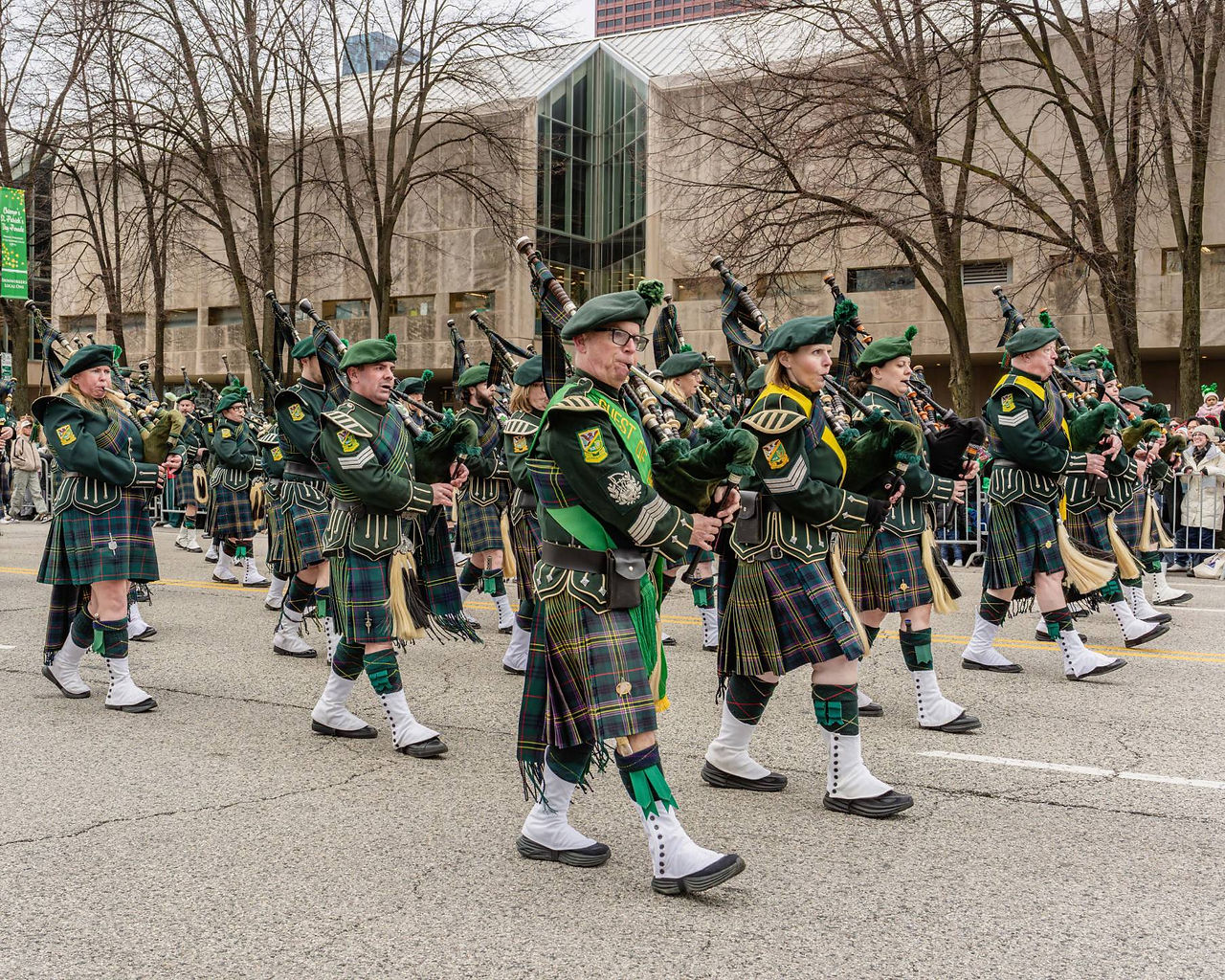 Bagpipers from Shannon Rovers Irish Pipe Band perform Irish music as they march Columbus Drive