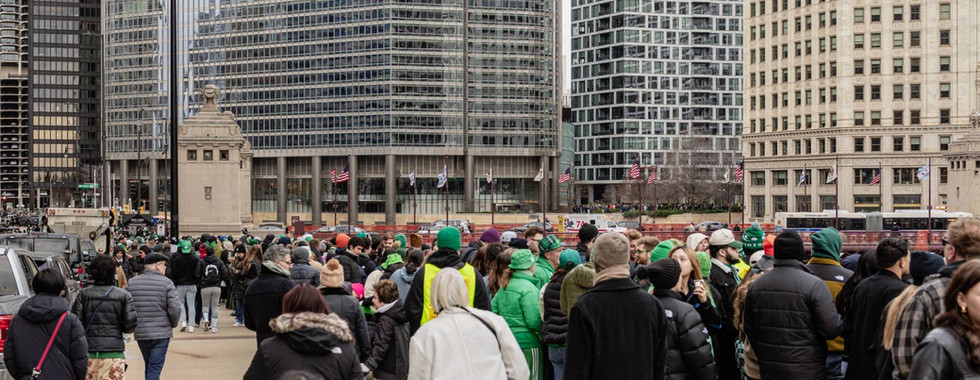 Crowds gather along the riverwalk for the tradition Dyeing the Chicago River green