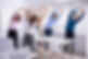Happy Businesspeople Doing Stretching Exercise Behind Desk At Workplace_edited.jpg