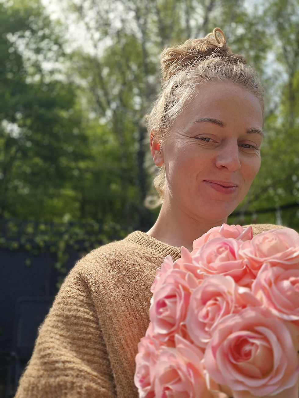 Our artificial Marshmallow bouquet of pink peach roses handtied held by Nic at home