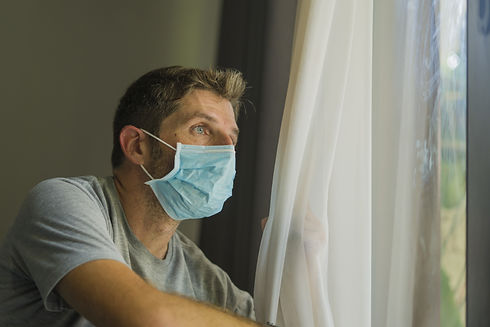 coronavirus man in mask at home - FLIPPE