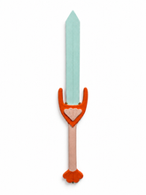 Ceramic sword with a mint-green blade, orange guard, pale pink handle, and shell details on a white background.