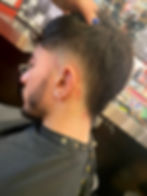 Fresh fade haircut by an alternative barber hair stylist