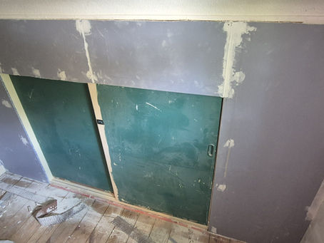 A layer of plasterboard on the small wall