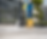 A maintenance worker washing a driveway