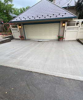 New concrete driveway in front of a home.