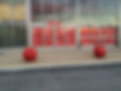 Business front hardscaping with new concrete and bollards