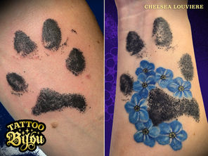 German Shepherd paw print memorial tattoos with floral detail by Chelsea Louviere Richfield Minnesota