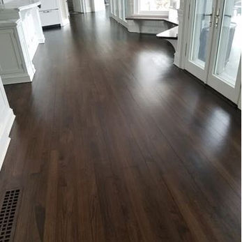a picture of a walnut floor refinishing