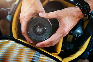 closeup-hands-getting-camera-lens-from-bag.jpg