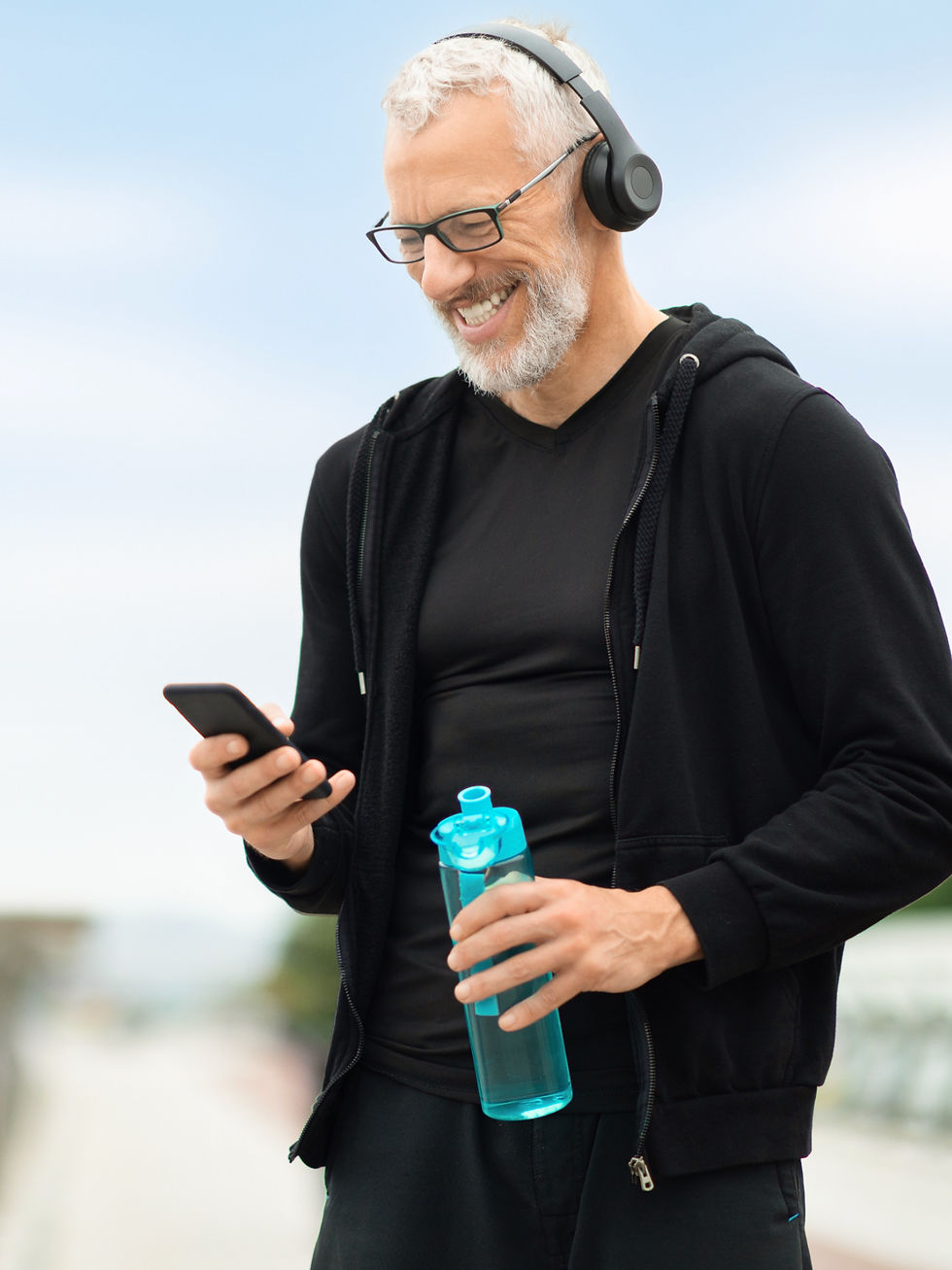 retired-sportsman-using-phone-while-resting-after-2025-04-01-21-23-50-utc (1)_edited.jpg