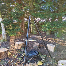 Forest scene with campfire cooking over a tripod.jpg