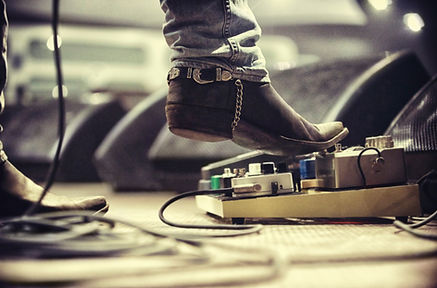 a person's feet on a record player