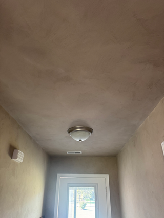 Coffee limewash living room with warm textured walls handcrafted by Limewash Painting LLC in Middle Tennessee.