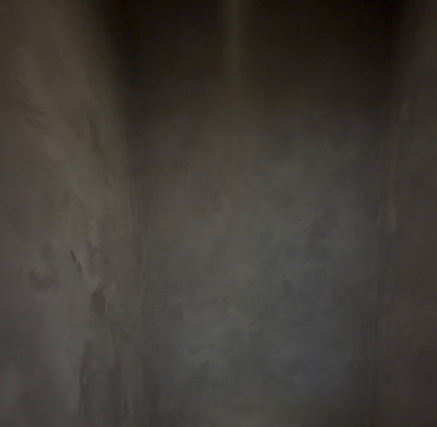 Black limewash accent wall with textured finish handcrafted by Limewash Painting LLC in Middle Tennessee.