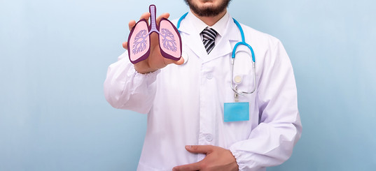 professional-male-doctor-with-lungs-human-figure-2025-02-02-14-04-19-utc.jpg
