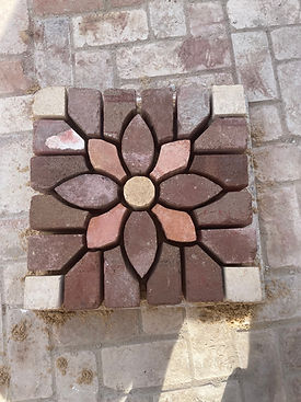 Decorative brick flower pattern feature wall created using recycled bricks in Newcastle NSW