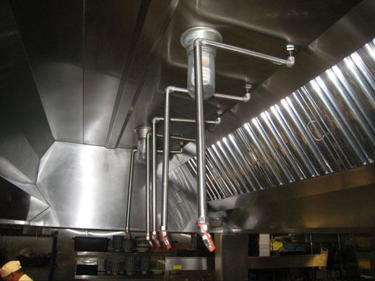 Close-up view of a commercial kitchen fire suppression system nozzle