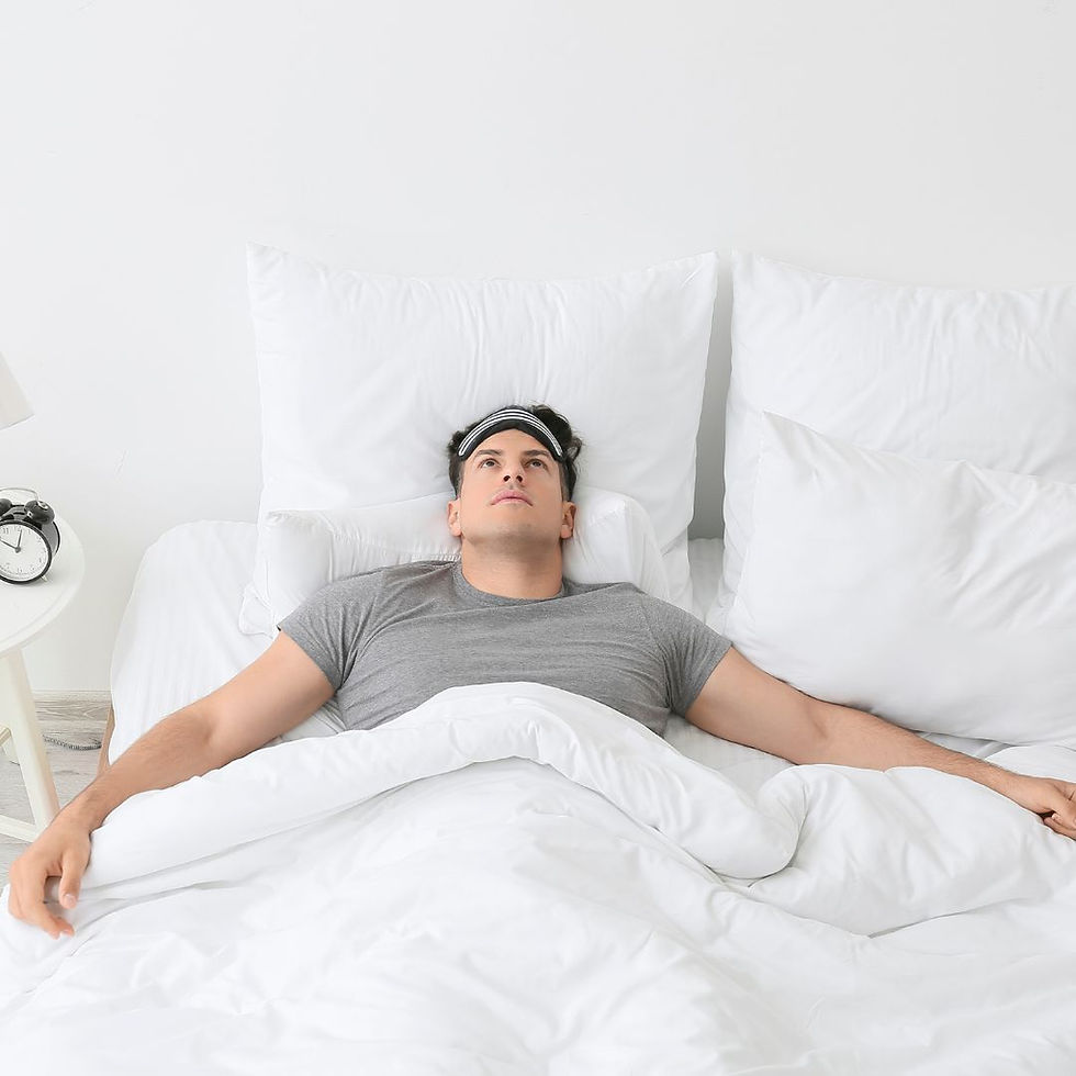 A man sleeping in a bed