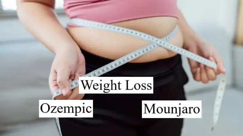 A woman measuring her belly with measuring tape