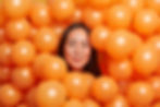 positive-brunette-asian-woman-surrounded-by-orange-2025-10-15-05-09-28-utc.jpg