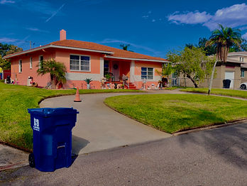 "Professional lawn care services by Full Service Lawn & Landscaping, featuring a lush, green lawn and vibrant flower bed in f