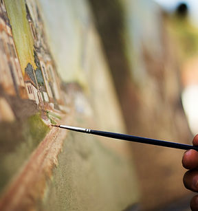 Winterville Children's Art Classes in Oil Painting a paint brush on a canvas with oil paint