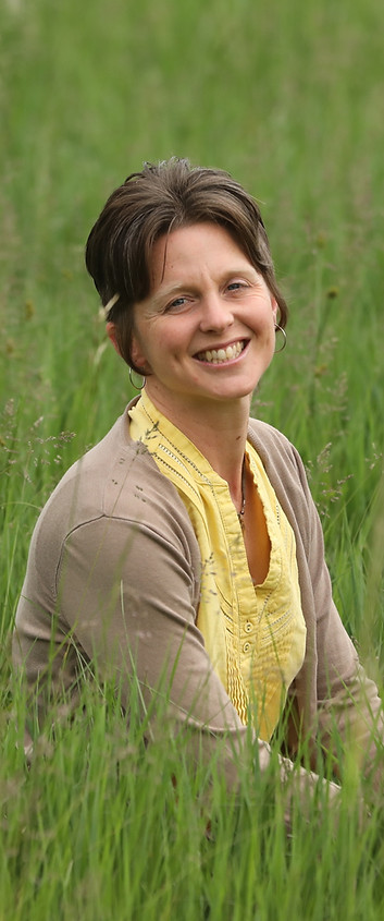 shannon smiling in the grass