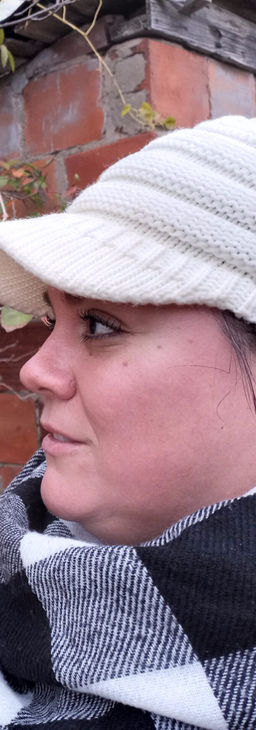 a woman touches a tree branch