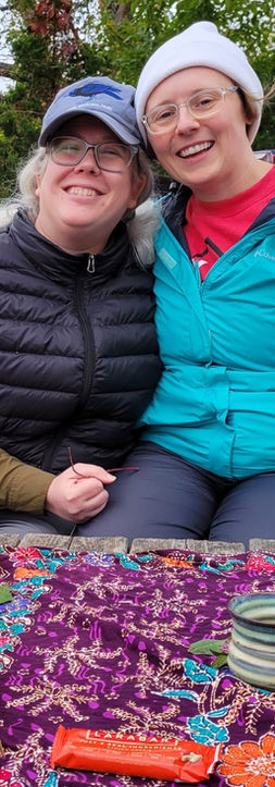 a couple enjoys tea outside in nature