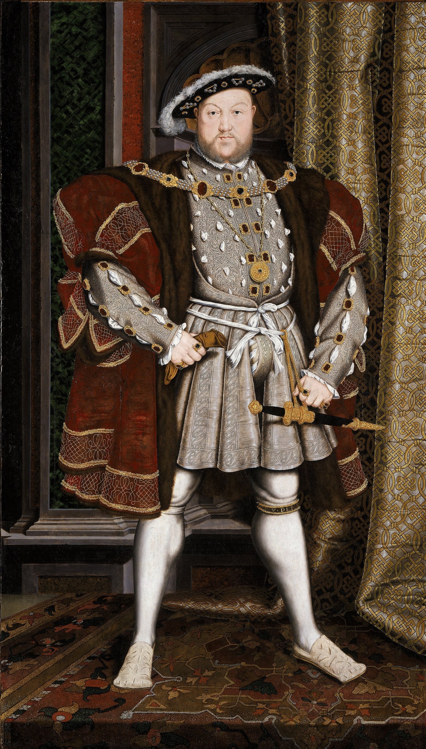 Workshop of Hans Holbein the Younger, portrait of Henry VIII, the king shown frontally in richly jewelled Tudor dress against a dark ground.