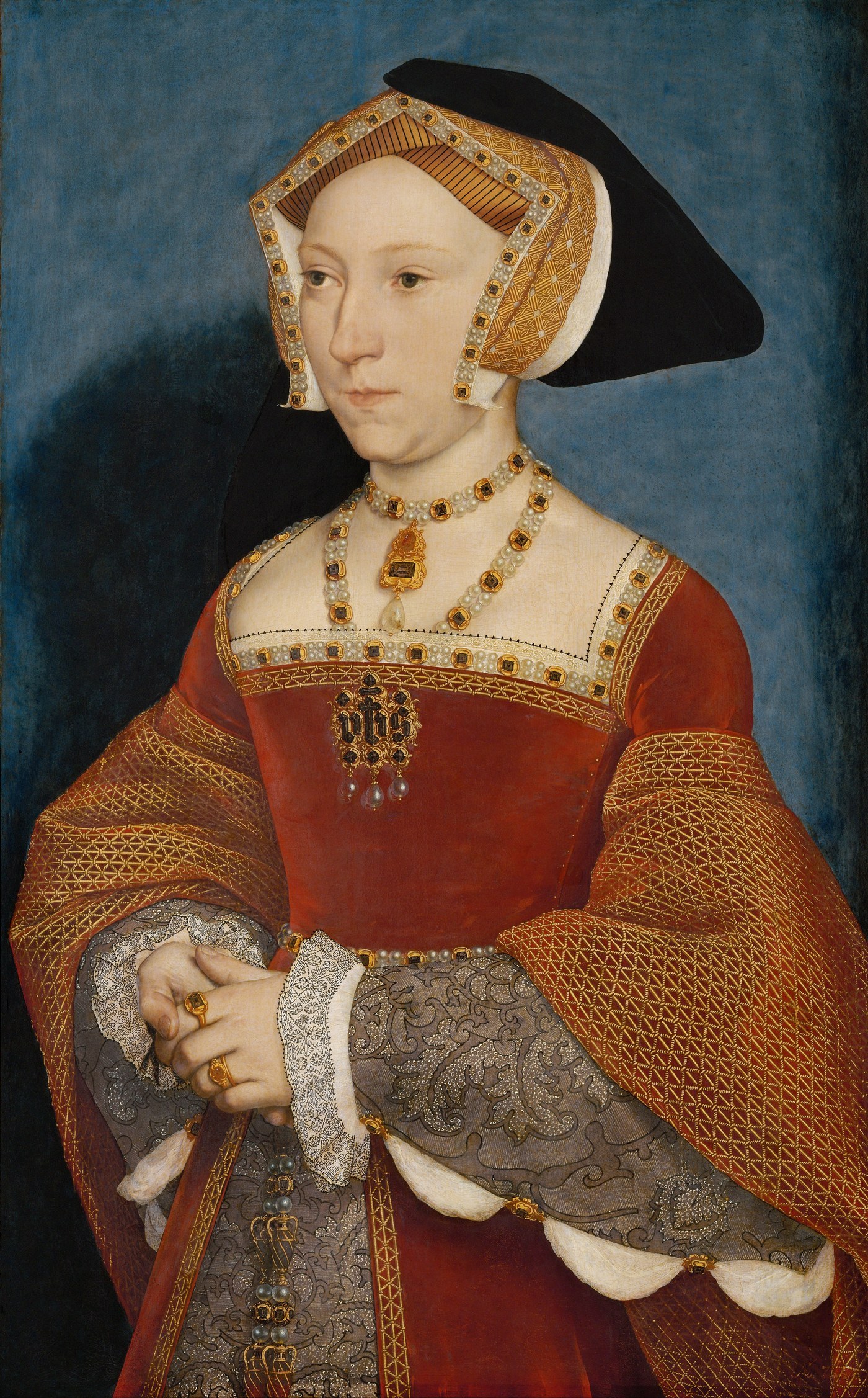 Hans Holbein the Younger, Jane Seymour, Queen of England (1536), the queen in a red and gold gown with a gable hood against a blue ground.