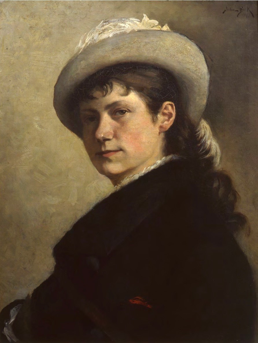 Julia Beck, Self-Portrait in a Plumed Hat (1880), oil on canvas, the young painter in a black coat and pale wide-brimmed hat turning to meet the viewer against a grey ground.