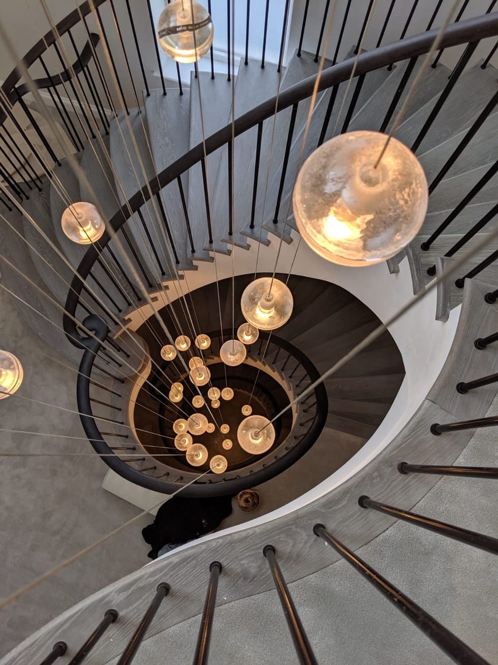 Image looking don on a curved stairs in Wimbledon high end property