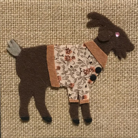 Brown Goat with Flower Coat