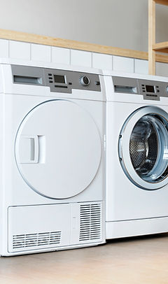 Front-load washer and dryer side by side in a laundry room