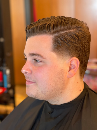 Low taper fade mens haircut on gentlemen at Chicago loops barbershop