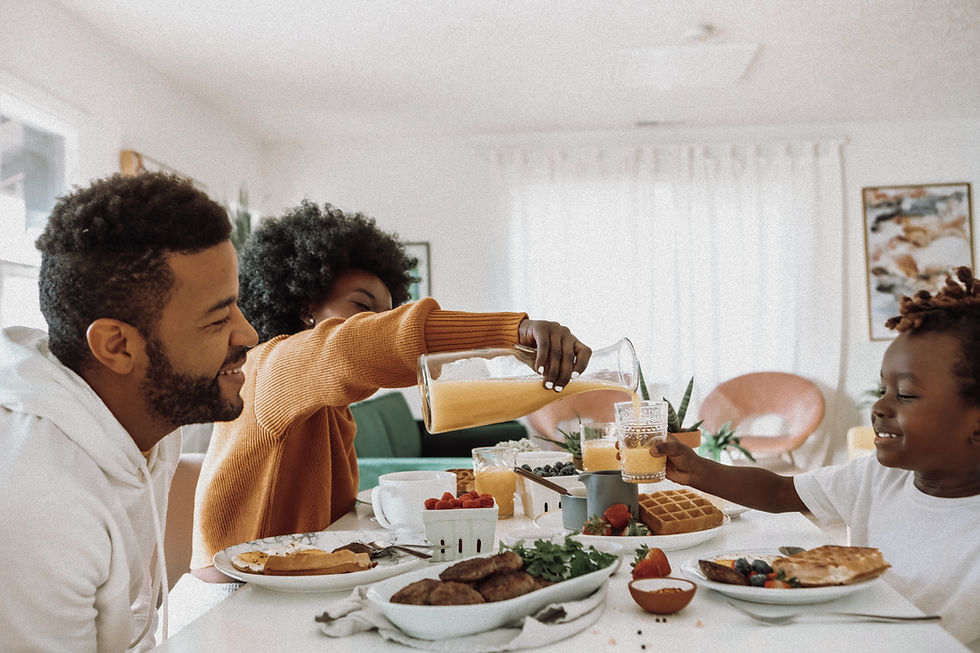 Family eating dinner together - healthy food connection