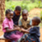 African children working and learning together.jpg
