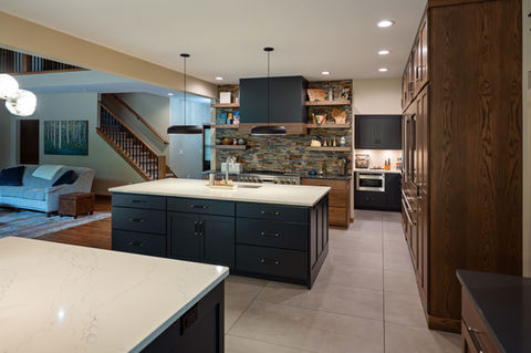 Open concept kitchen with custom cabinetry and built-in corner nook 