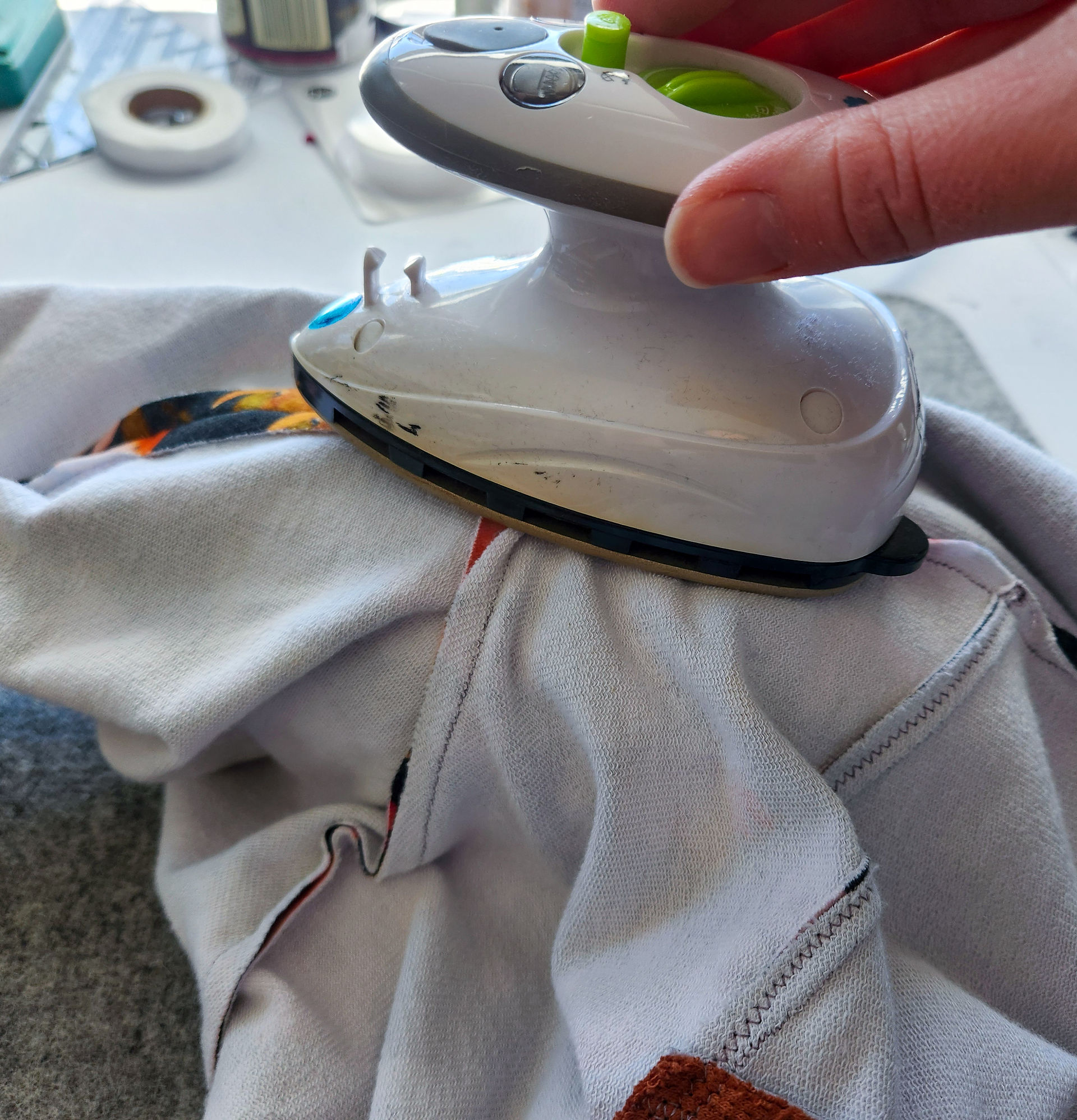 Pressing a curved sleeve seam on a tailor's ham