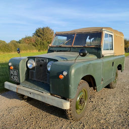 Front view of a vintage Series 2 Land Rover in field