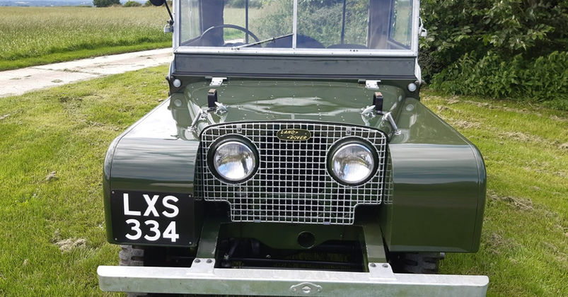Face on view of a green Land Rover, Series 1, 1951 80" model.